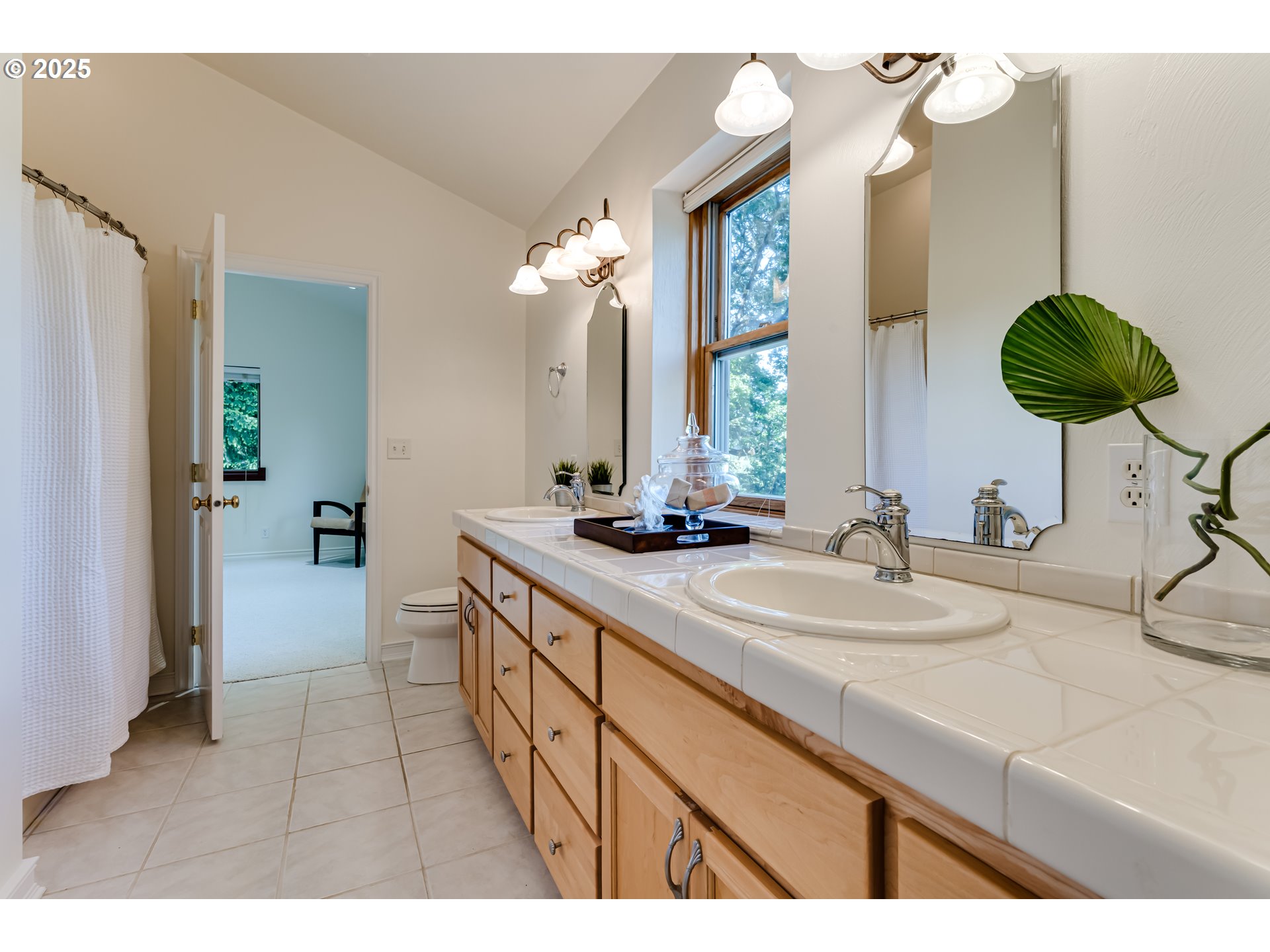 27161 Briggs Hill Road Eugene, OR 97405 - Photo 33 of 47 a bathroom with a double vanity sink and a mirror