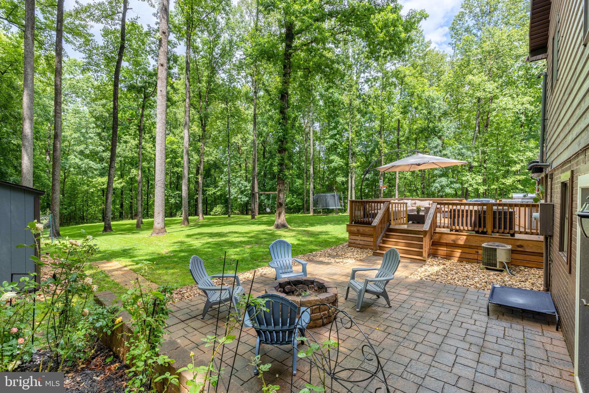 1425 Jacks Shop Road Rochelle, VA 22738 - Photo 5 of 56 a view of a patio with chairs and table in a yard