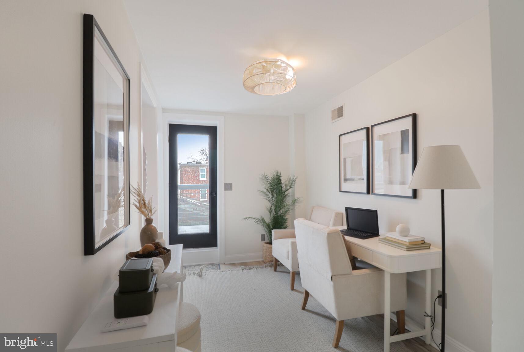 226 South Madeira Street Baltimore, MD 21231 - Photo 11 of 21 a living room with furniture a chandelier and a window