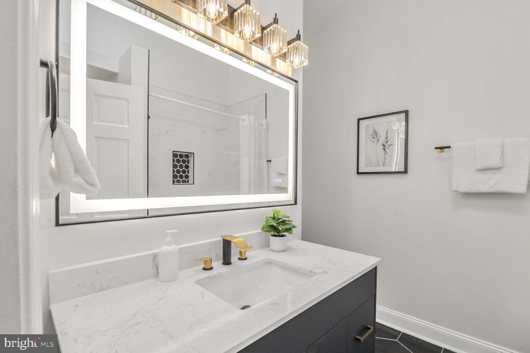 226 South Madeira Street Baltimore, MD 21231 - Photo 13 of 21 a bathroom with a sink and a mirror
