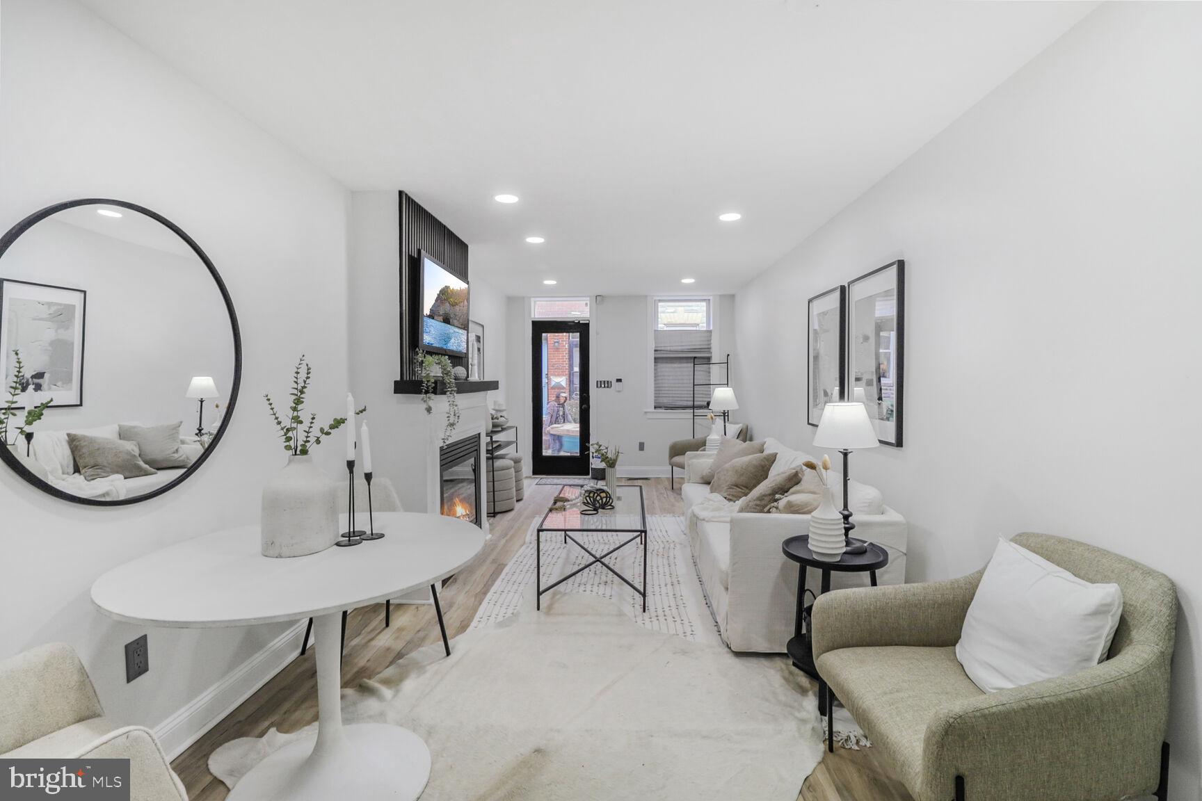 226 South Madeira Street Baltimore, MD 21231 - Photo 2 of 21 a living room with furniture a mirror and a mirror