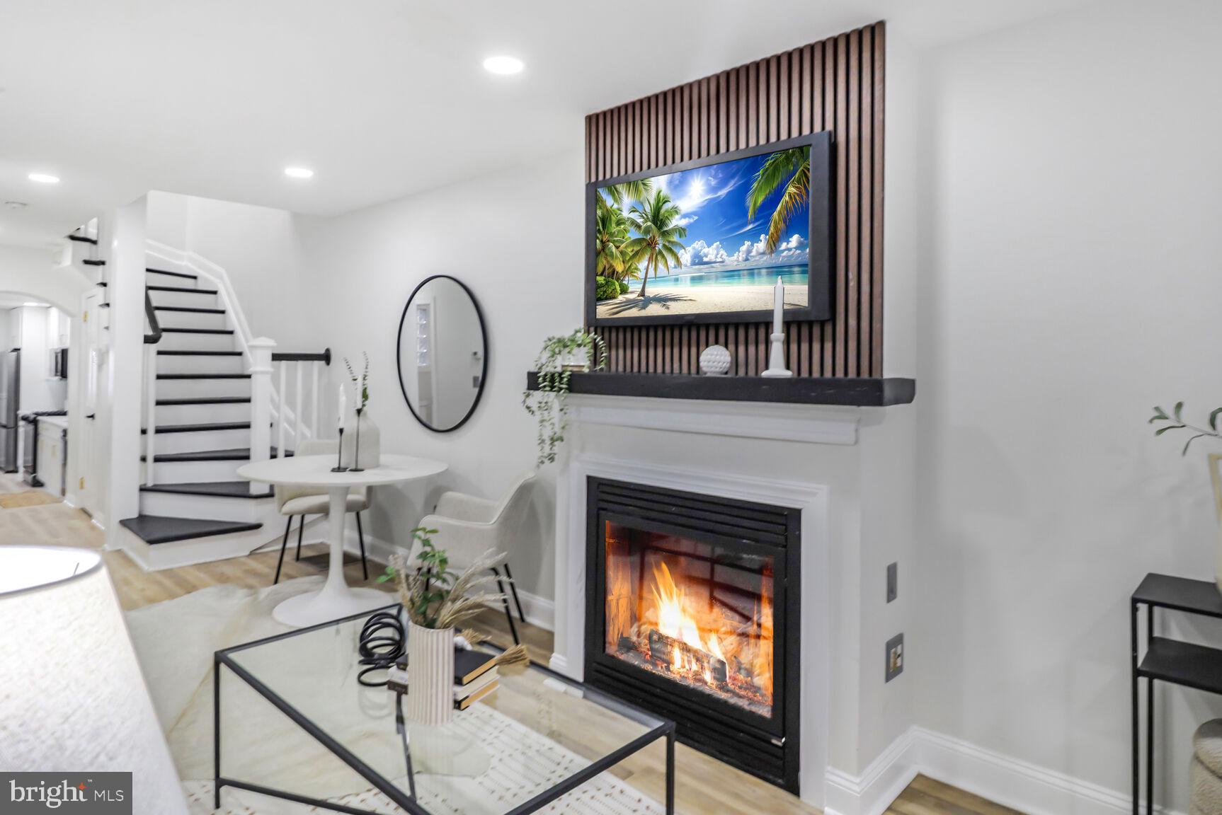 226 South Madeira Street Baltimore, MD 21231 - Photo 5 of 21 a living room with furniture a rug and a fireplace