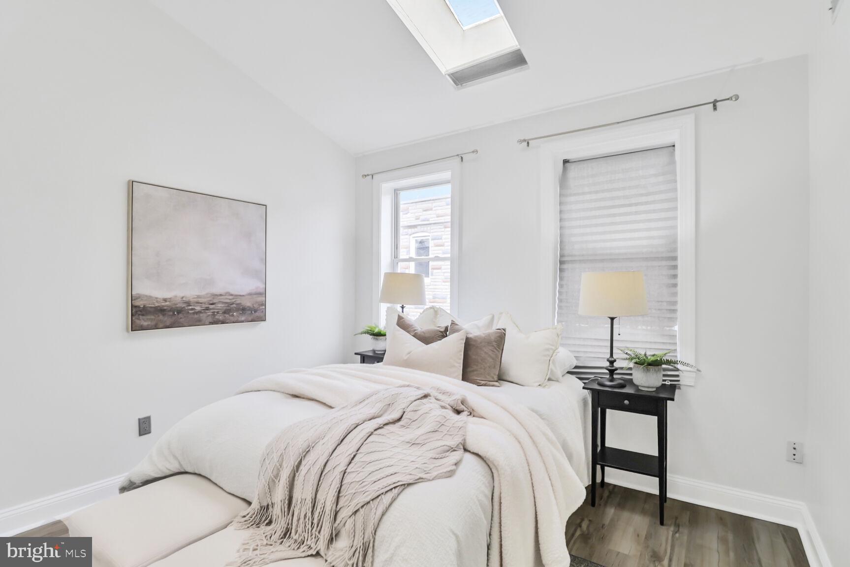 226 South Madeira Street Baltimore, MD 21231 - Photo 10 of 21 a bedroom with a bed and a table
