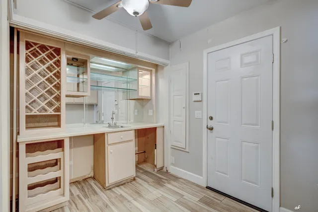 a room with cabinets and wooden floor