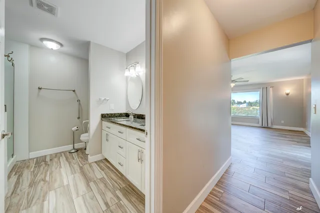 a bathroom with a double vanity sink and a mirror