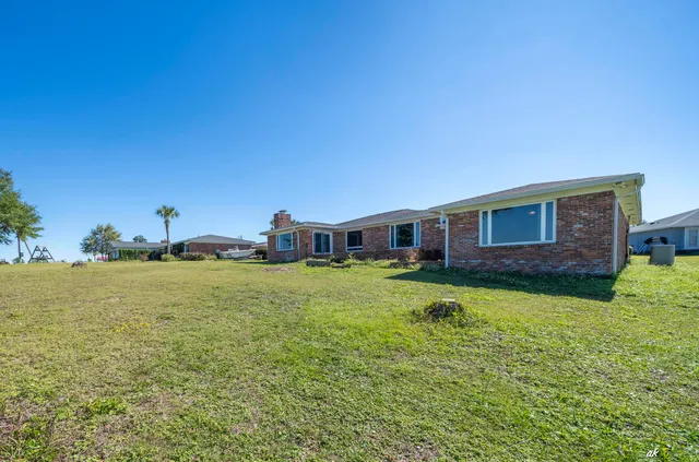 a aerial view of a house with a yard