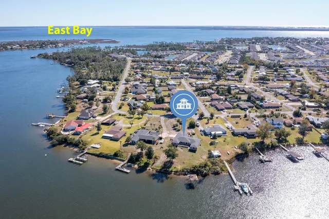 an aerial view of a house with a swimming pool yard and outdoor seating