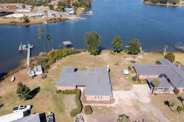 an aerial view of a house with a table and chair