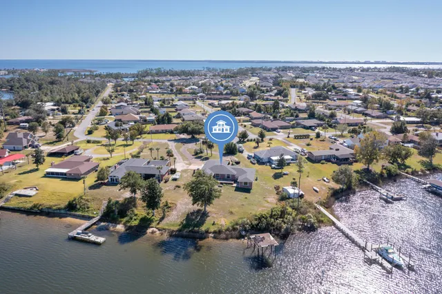 an aerial view of a house with a swimming pool