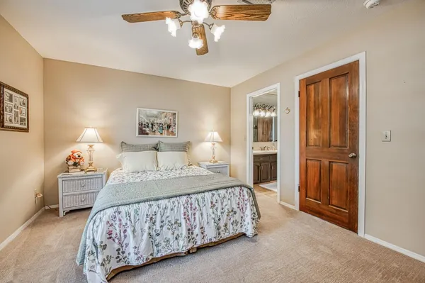 a bedroom with a bed and cabinets