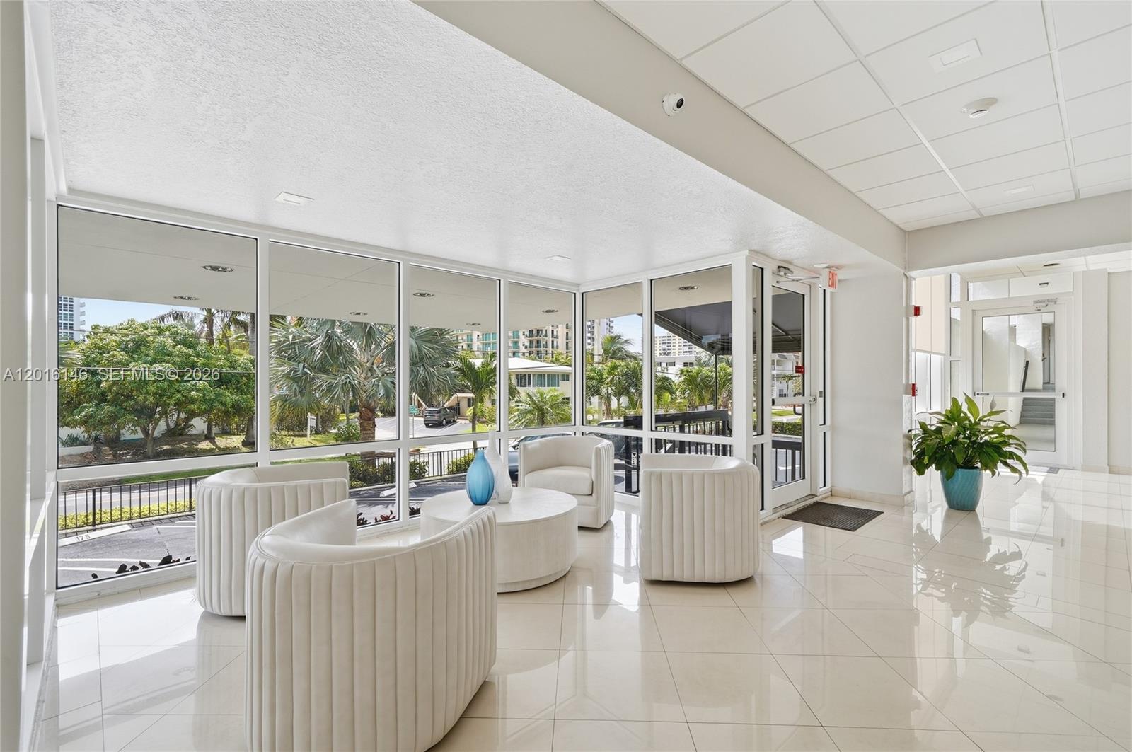 521 North Riverside Drive, Unit 606 Pompano Beach, FL 33062 - Photo 25 of 50 a room with furniture and large windows