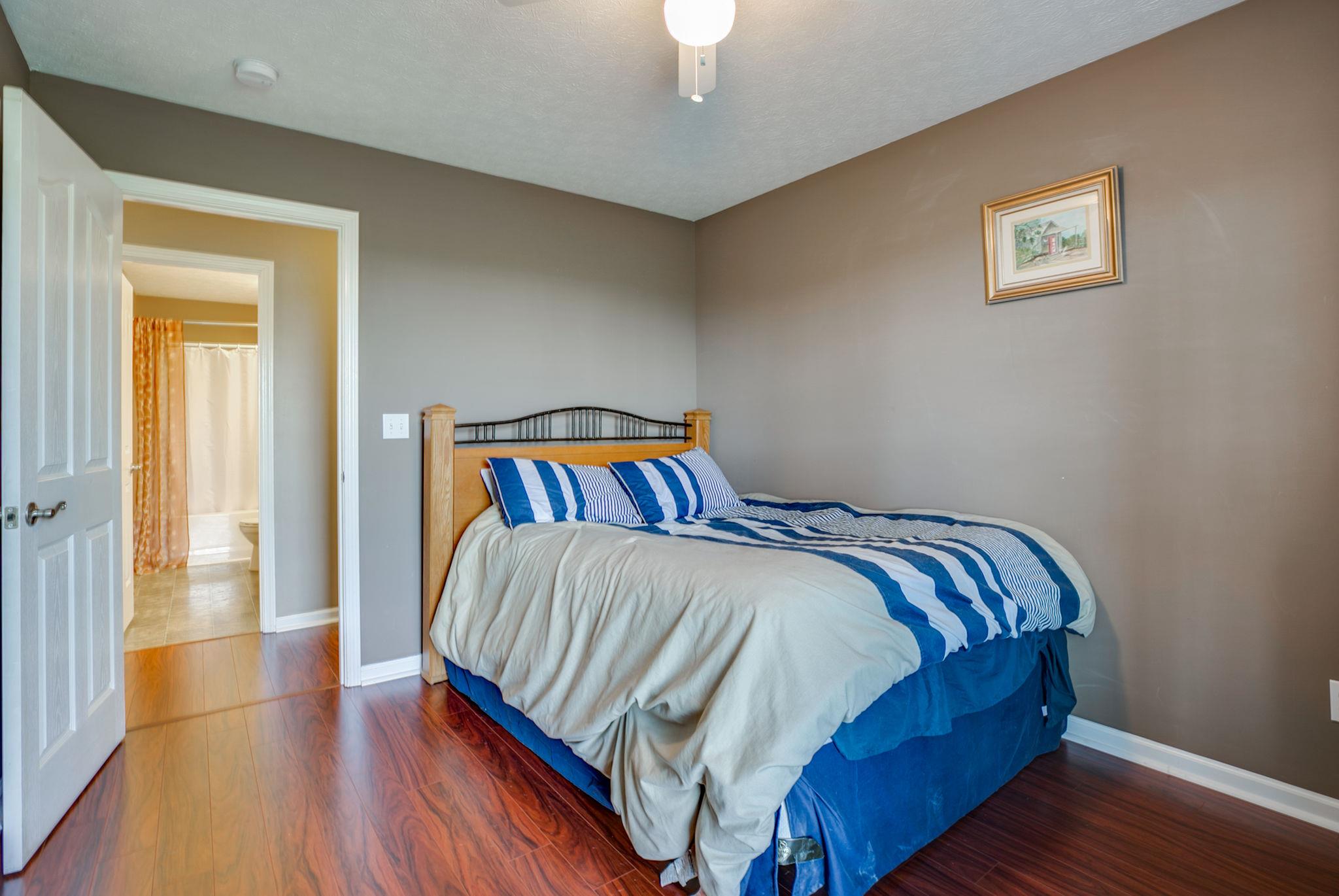 229 Rich Road Unionville, TN 37180 - Photo 30 of 30 a bedroom with a bed and wooden floor