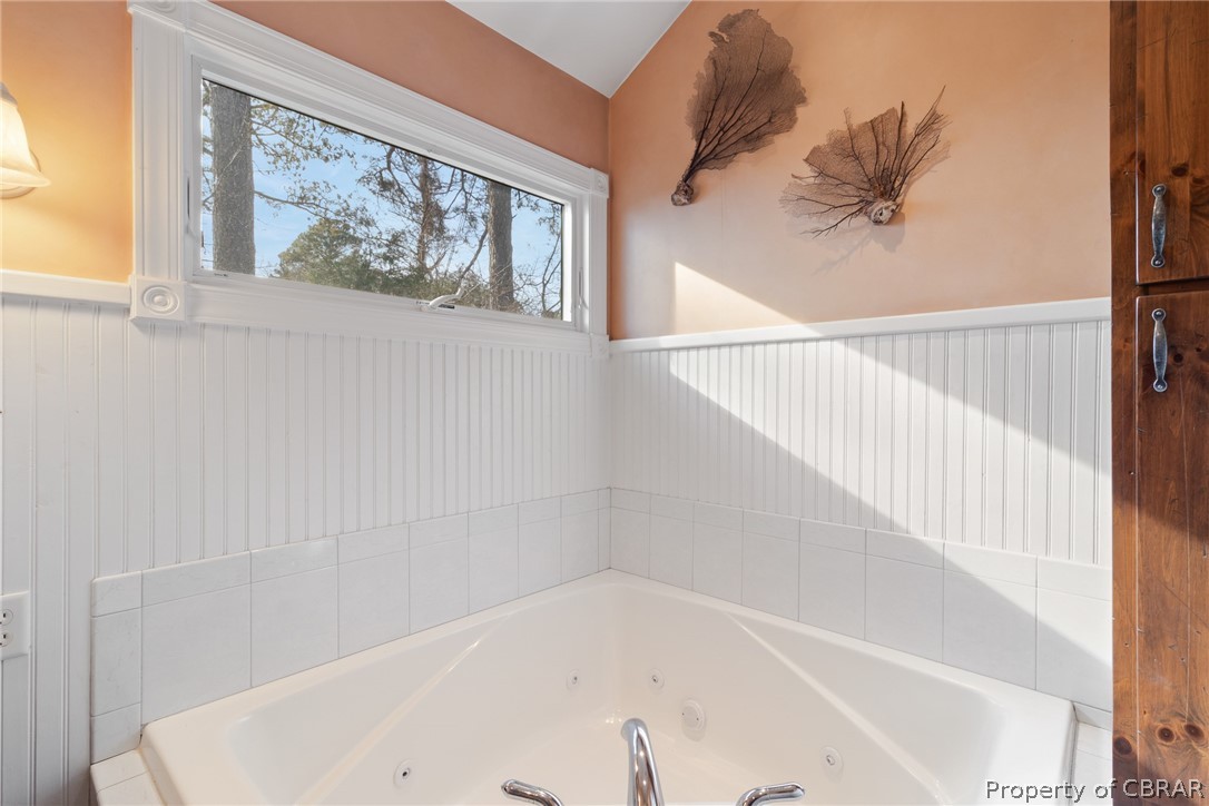 54 Murphy Street Reedville, VA 22539 - Photo 28 of 50 a bathroom with a bathtub and a shower