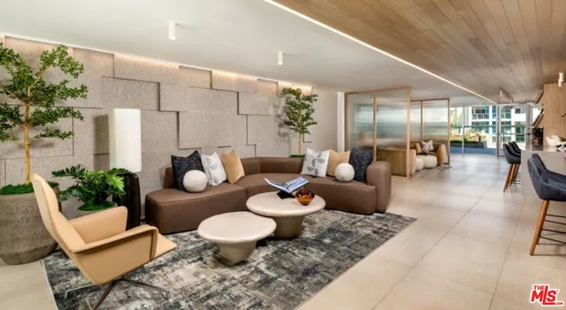 a living room with furniture and flowers