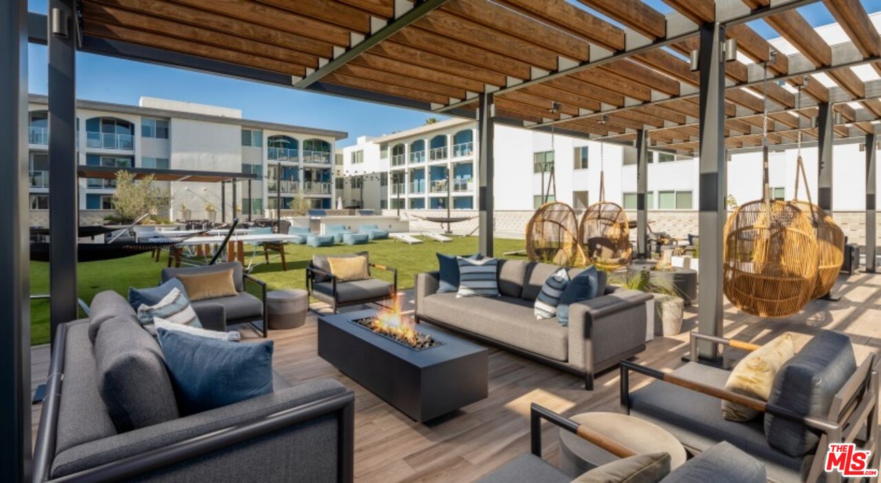 13900 Panay Way, Unit M312 Marina del Rey, CA 90292 - Photo 16 of 21 a living room with furniture and a large window