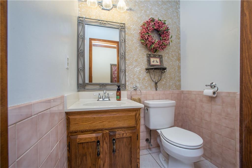662 Bocktown Cork Road Clinton, PA 15026 - Photo 11 of 25 A tiled partial bath completes the main level.