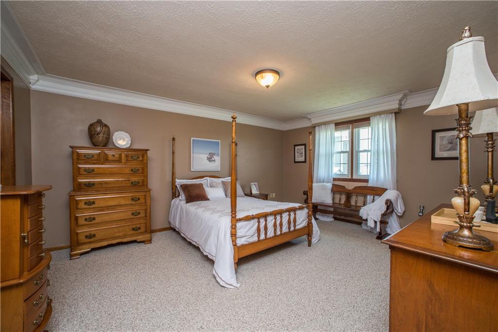 662 Bocktown Cork Road Clinton, PA 15026 - Photo 12 of 25 The home's 3 bedrooms are all located on the upper level. This view of the spacious master bedroom highlights the wide crown moldings and double window overlooking the front of the home.