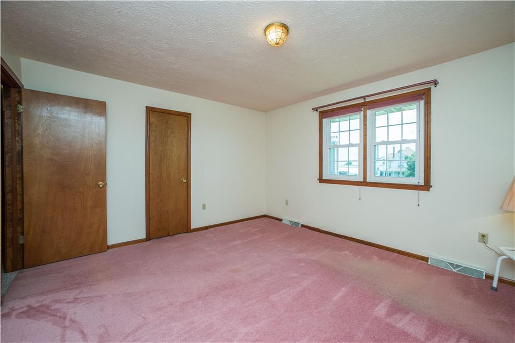 662 Bocktown Cork Road Clinton, PA 15026 - Photo 15 of 25 The home's 2nd bedroom faces the front of the home and has a sizable walk-in closet.