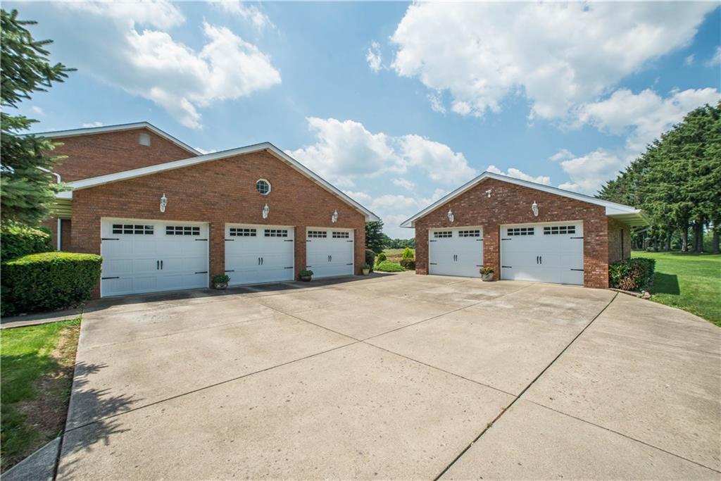 662 Bocktown Cork Road Clinton, PA 15026 - Photo 20 of 25 The garages feature newer garage doors and openers. The deep 2 car garage provides great storage for lawn equipment.
