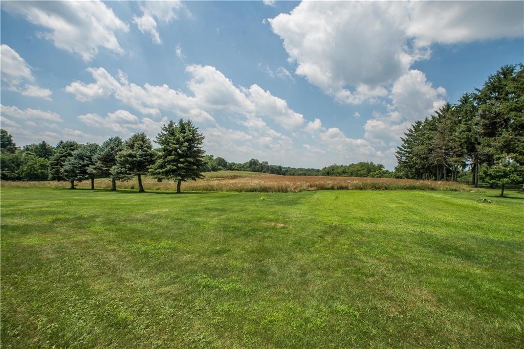 662 Bocktown Cork Road Clinton, PA 15026 - Photo 25 of 25 This view shows the approximate right property line marked by the row of pines. According to the seller, the back property line goes into the group of trees seen in the distance center right of this photo.
