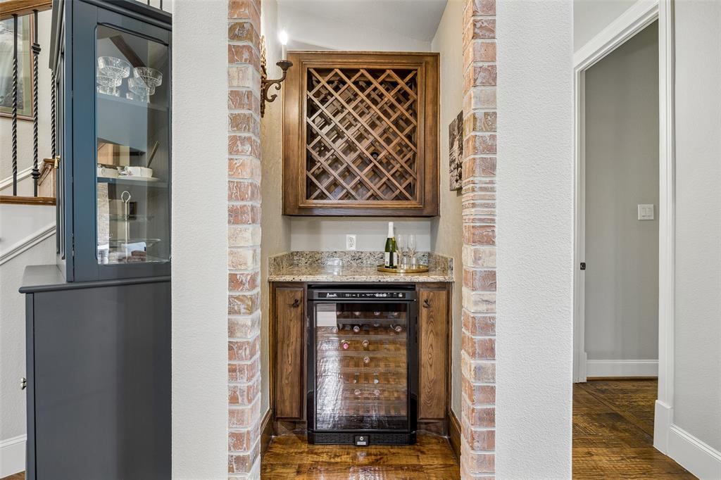 1608 Tuscan Ridge Circle Southlake, TX 76092 - Photo 13 of 36 a view of an entryway with wooden floor and a fireplace