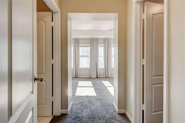 a view of a bathroom from a hallway