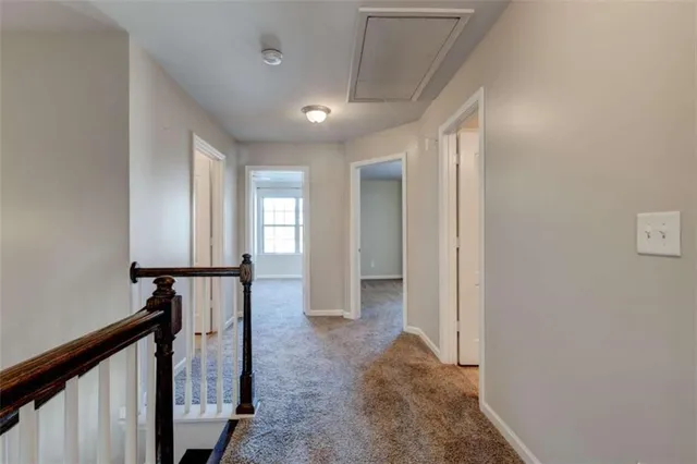 a view of a hallway with windows