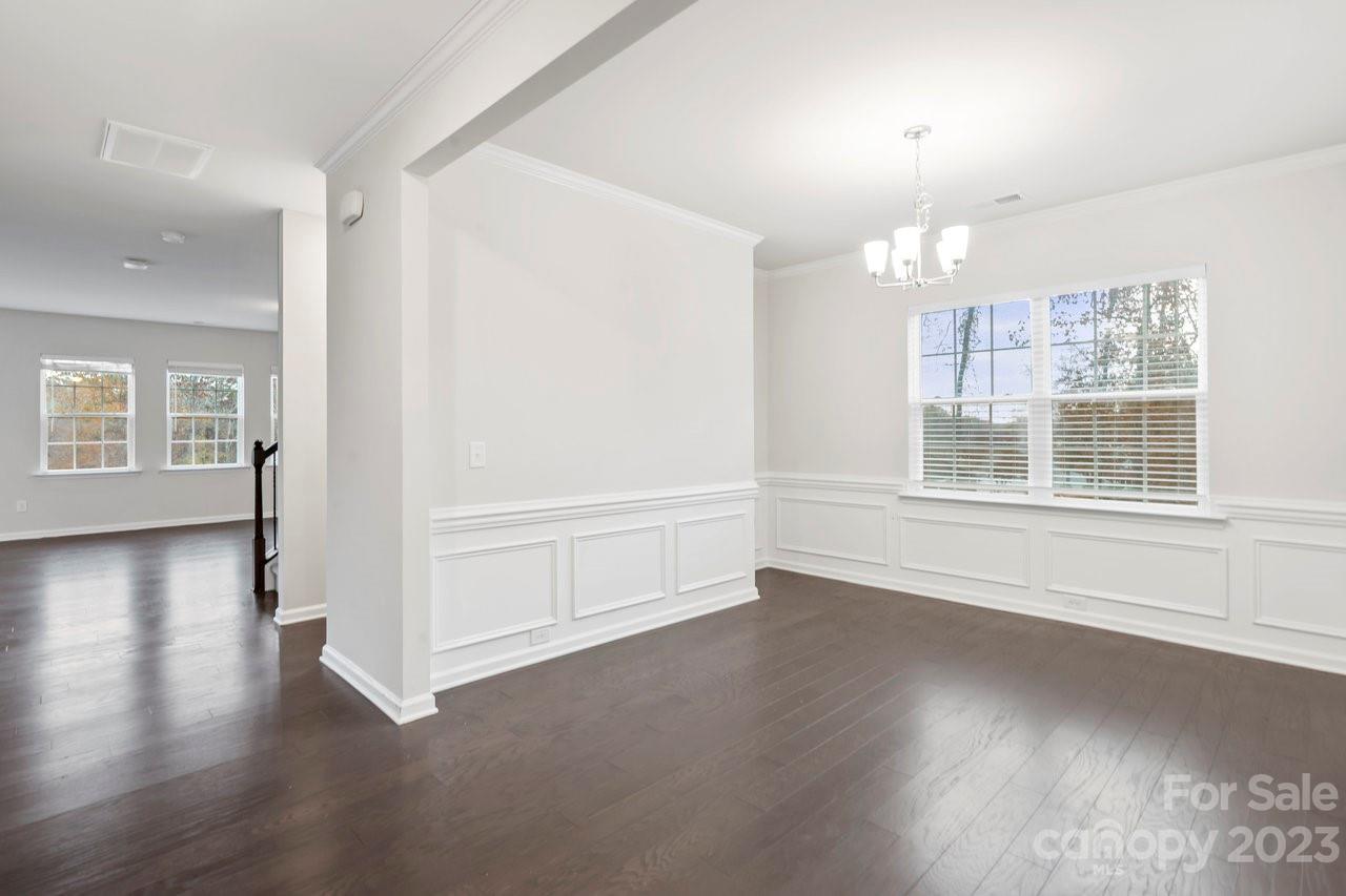 18209 Kalabash Road Charlotte, NC 28278 - Photo 13 of 48 an empty room with wooden floor and windows
