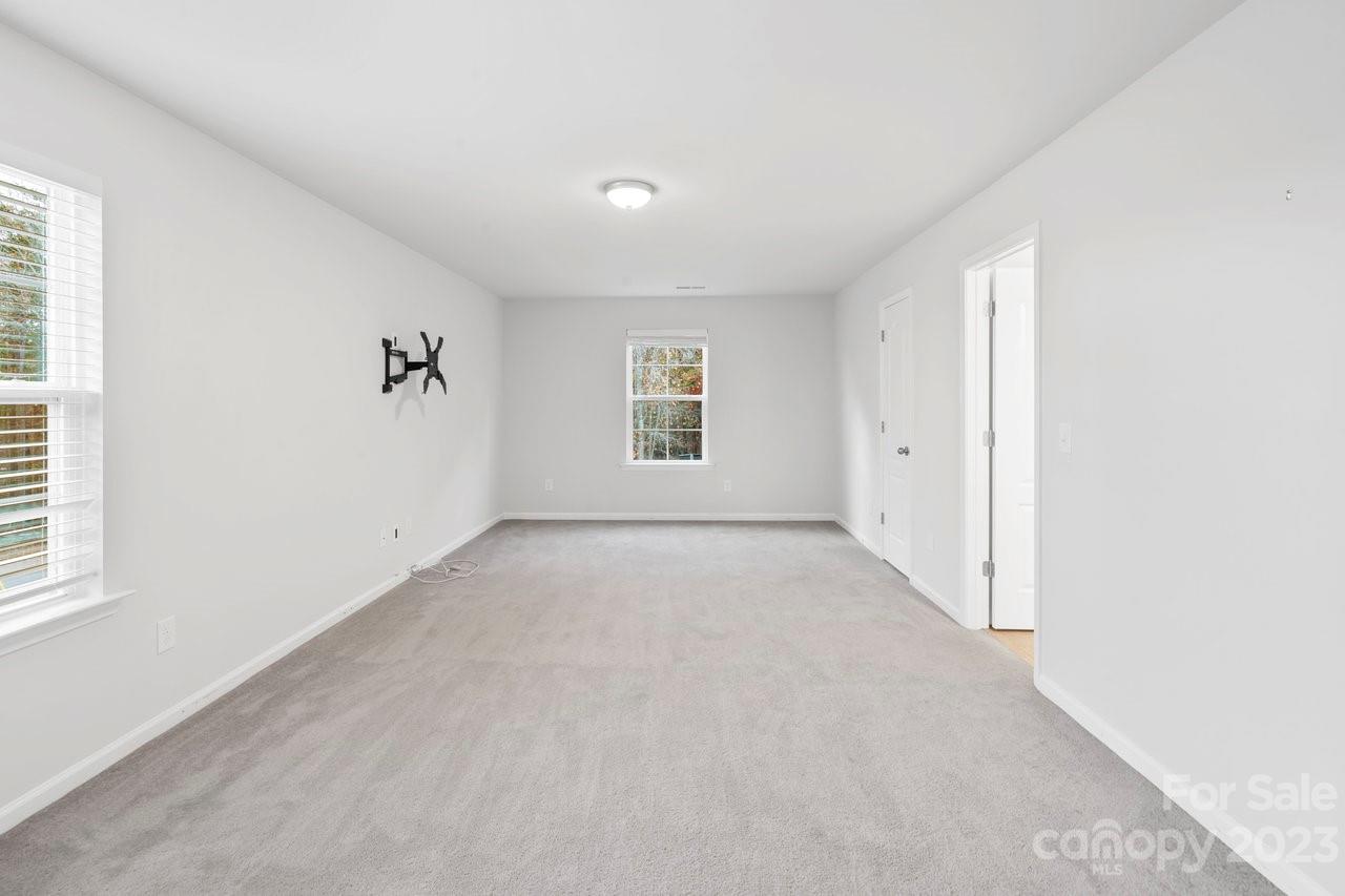 18209 Kalabash Road Charlotte, NC 28278 - Photo 16 of 48 an empty room with windows and closet