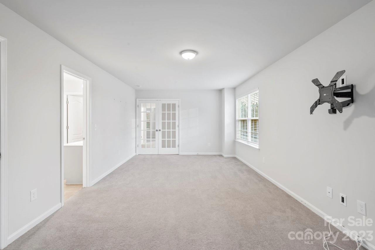 18209 Kalabash Road Charlotte, NC 28278 - Photo 17 of 48 a view of an empty room with a window