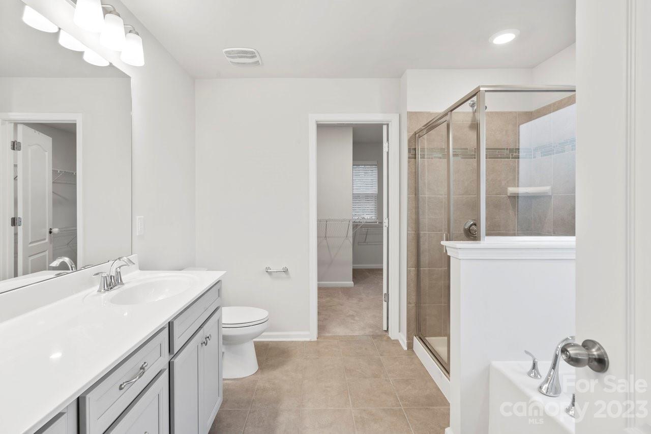 18209 Kalabash Road Charlotte, NC 28278 - Photo 24 of 48 a bathroom with a sink a toilet and shower