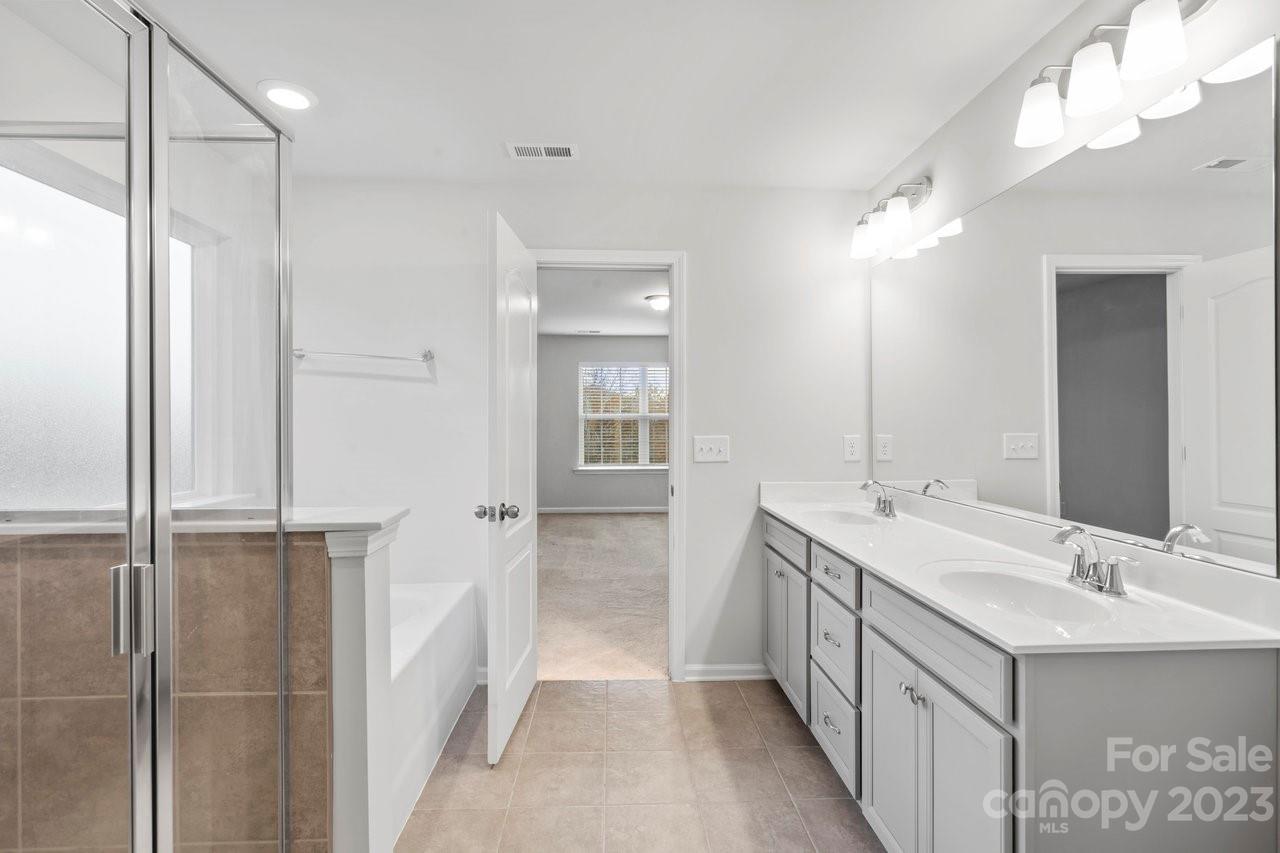 18209 Kalabash Road Charlotte, NC 28278 - Photo 25 of 48 a bathroom with a double vanity sink mirror and double