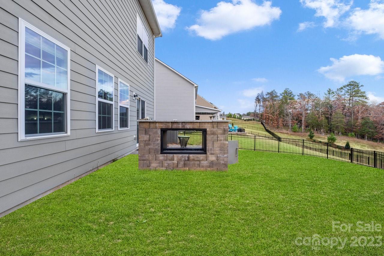 18209 Kalabash Road Charlotte, NC 28278 - Photo 34 of 48 a view of a backyard with a garden