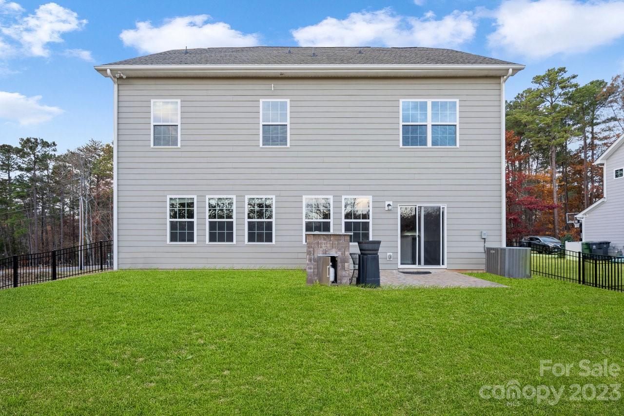 18209 Kalabash Road Charlotte, NC 28278 - Photo 35 of 48 a front view of house with yard and outdoor seating