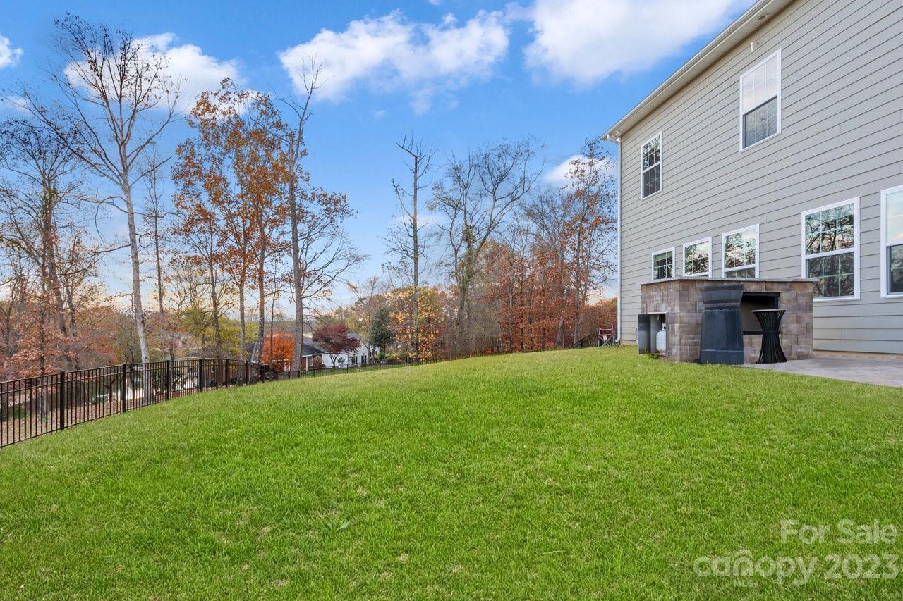 18209 Kalabash Road Charlotte, NC 28278 - Photo 36 of 48 a view of a backyard with wooden fence