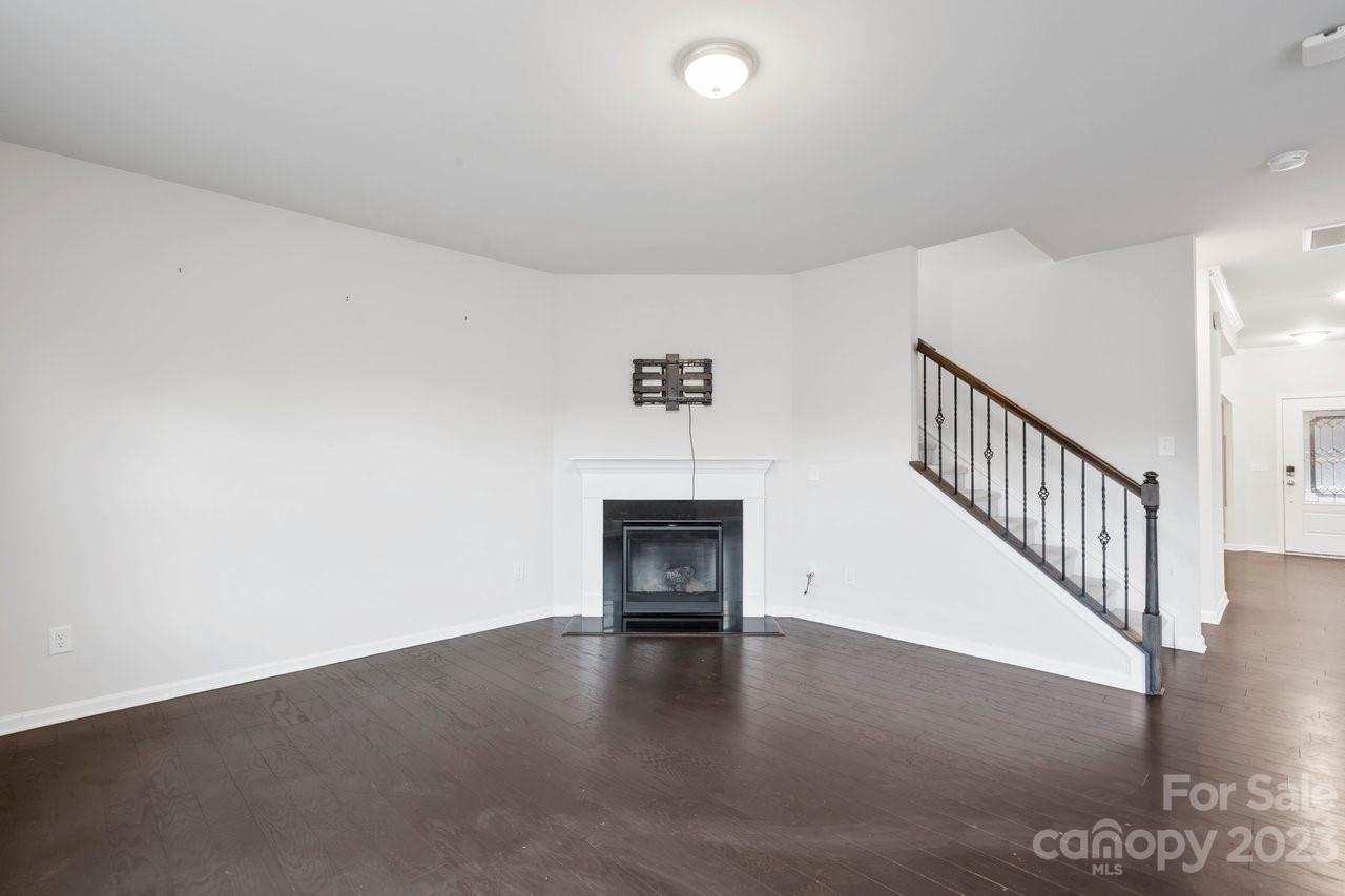 18209 Kalabash Road Charlotte, NC 28278 - Photo 4 of 48 a view of an empty room with wooden floor and a window