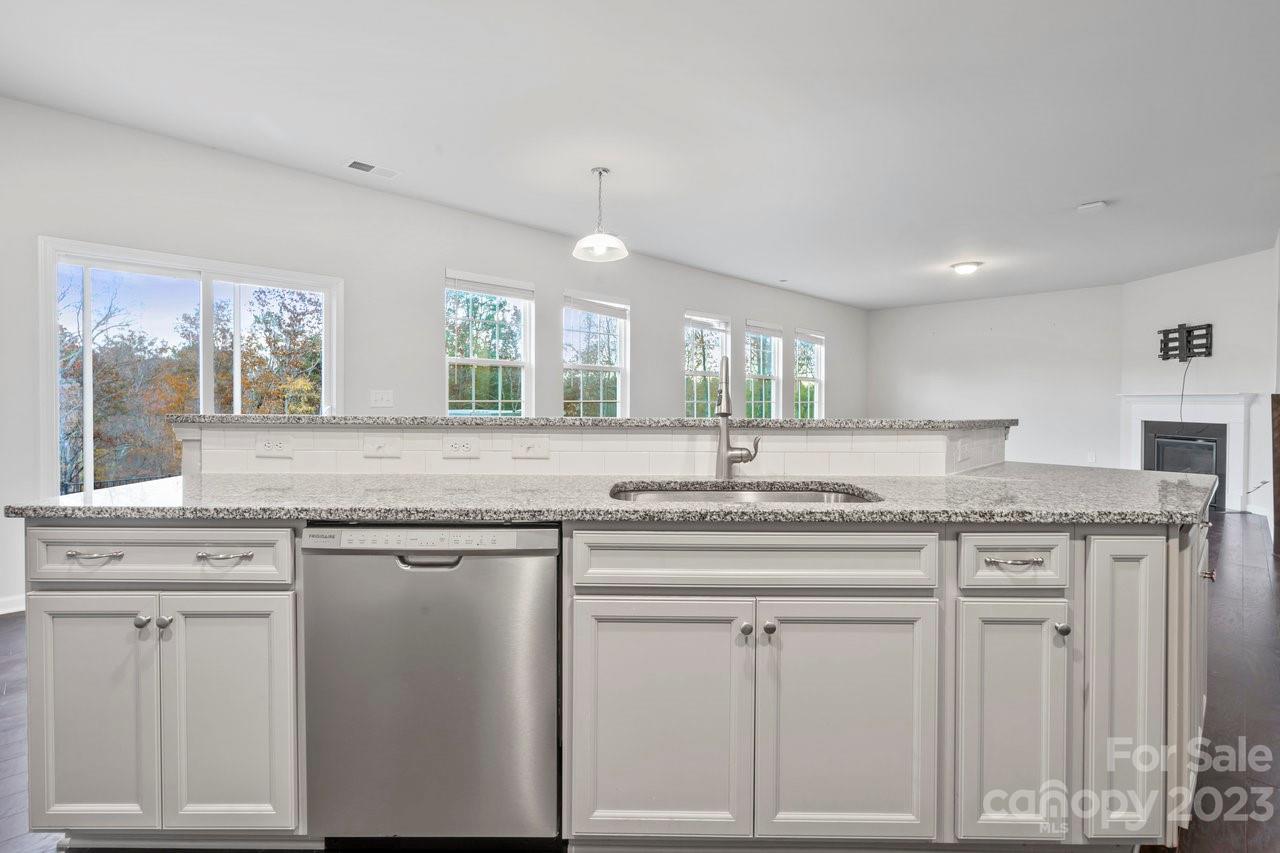 18209 Kalabash Road Charlotte, NC 28278 - Photo 10 of 48 a kitchen with white cabinets and sink