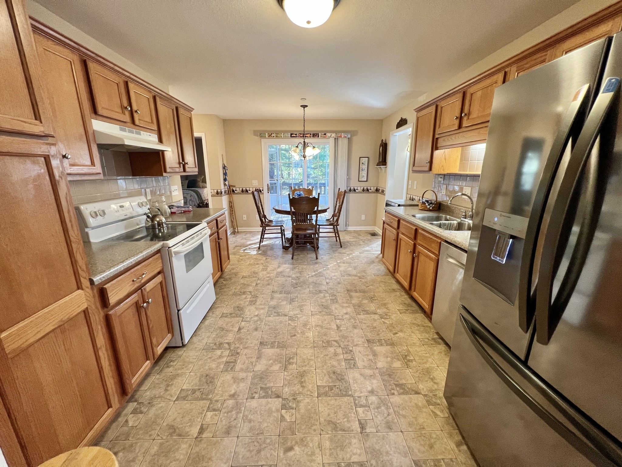 291 Bailey Lane Pleasant View, TN 37146 - Photo 12 of 37 a kitchen with stainless steel appliances granite countertop a refrigerator stove microwave and sink