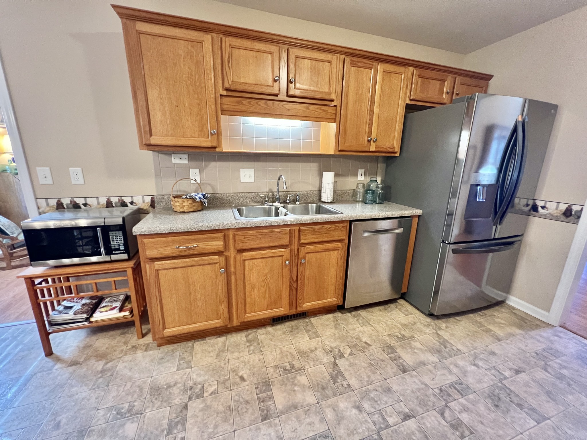 291 Bailey Lane Pleasant View, TN 37146 - Photo 13 of 37 a kitchen with stainless steel appliances a sink and a refrigerator