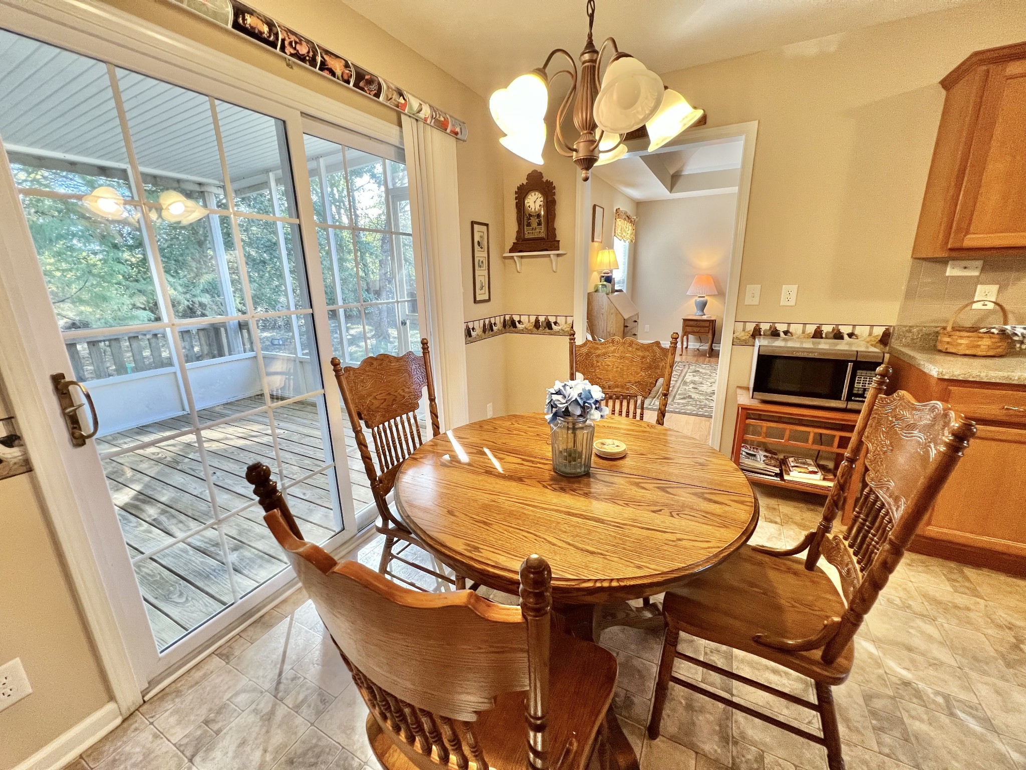 291 Bailey Lane Pleasant View, TN 37146 - Photo 16 of 37 a view of a dining room with furniture wooden floor and chandelier