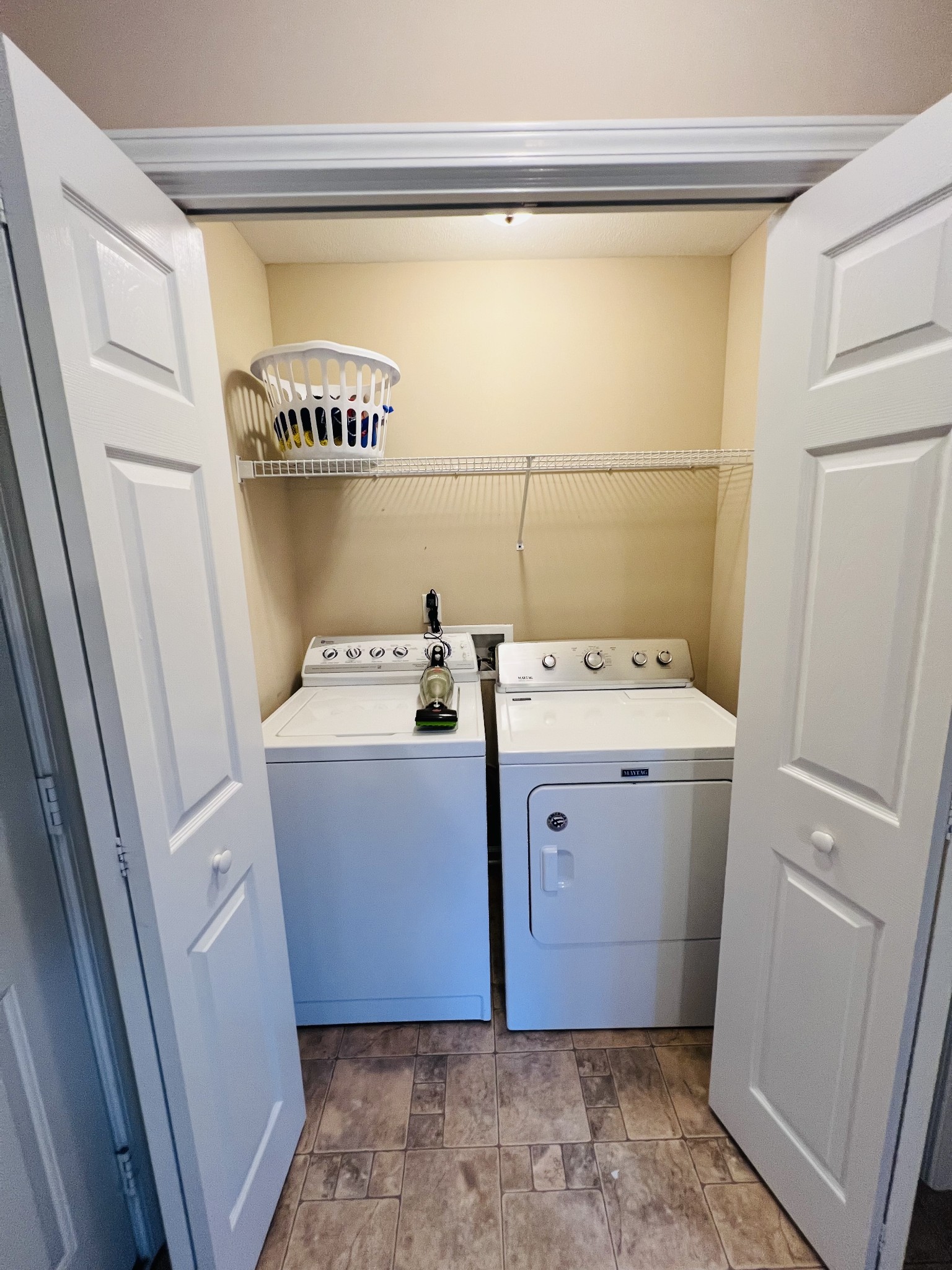 291 Bailey Lane Pleasant View, TN 37146 - Photo 18 of 37 a utility room with a washer dryer and white cabinets
