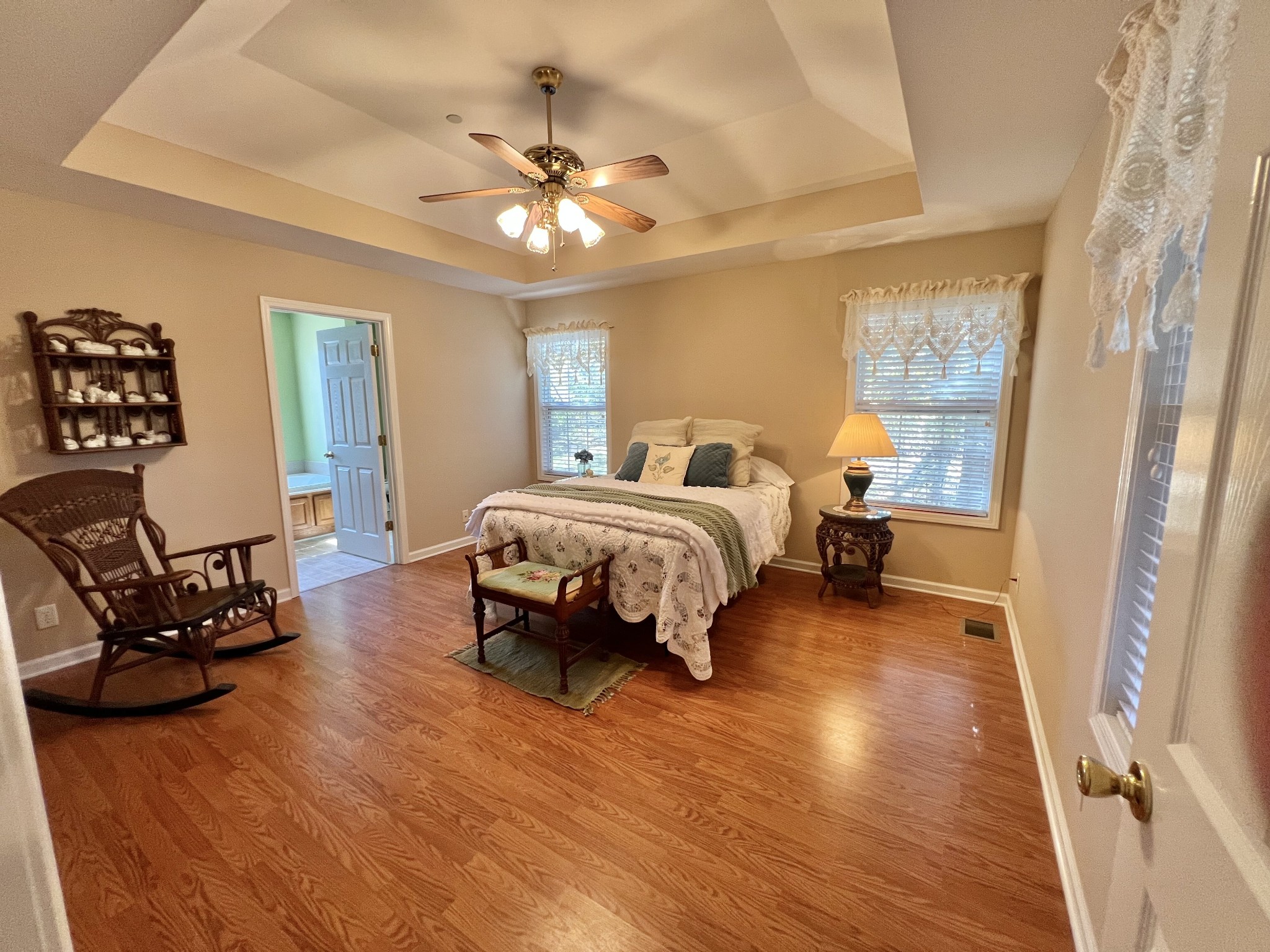 291 Bailey Lane Pleasant View, TN 37146 - Photo 19 of 37 a spacious bedroom with a bed and a chandelier