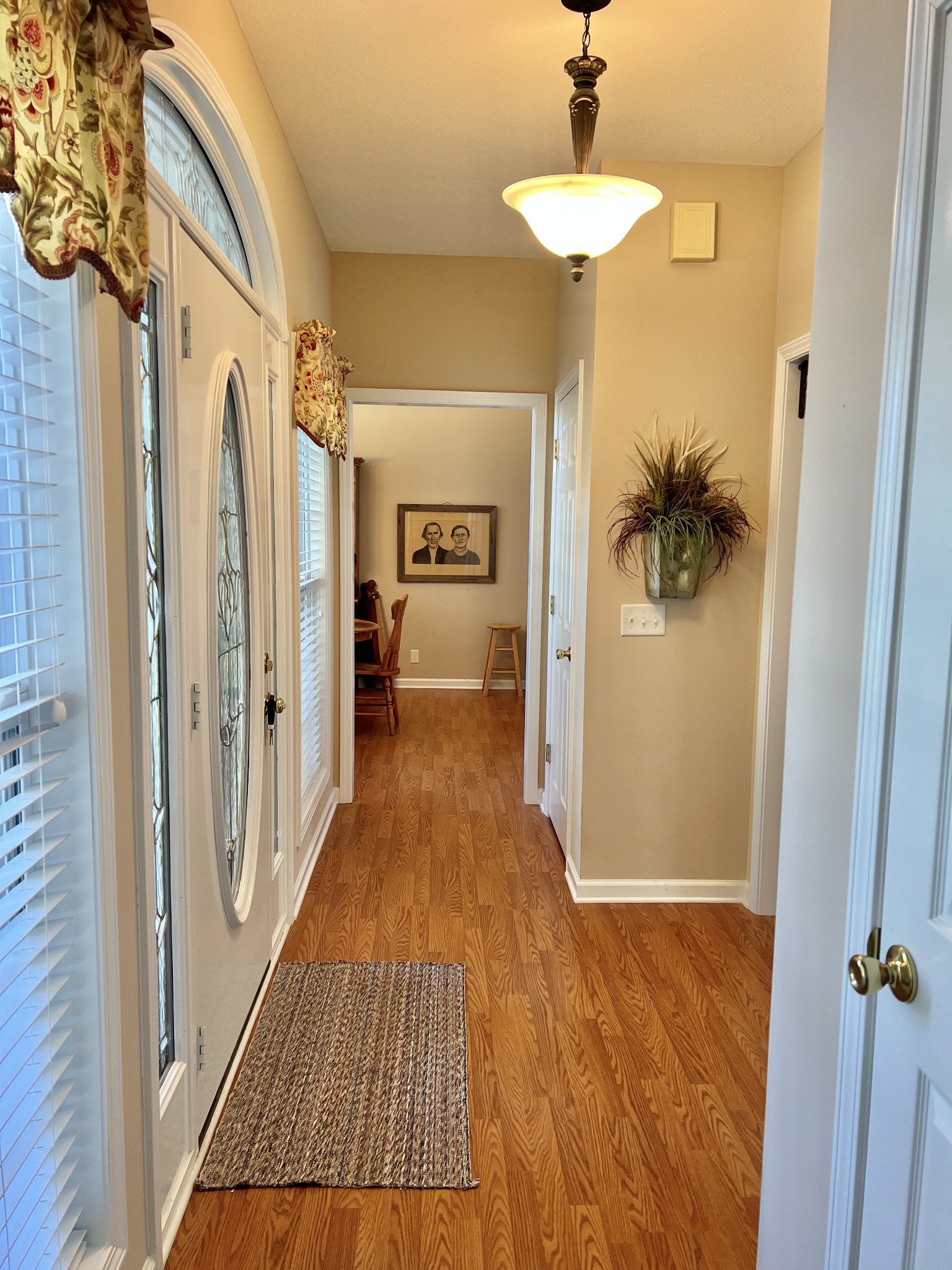 291 Bailey Lane Pleasant View, TN 37146 - Photo 8 of 37 a view of a hallway with wooden floor and staircase