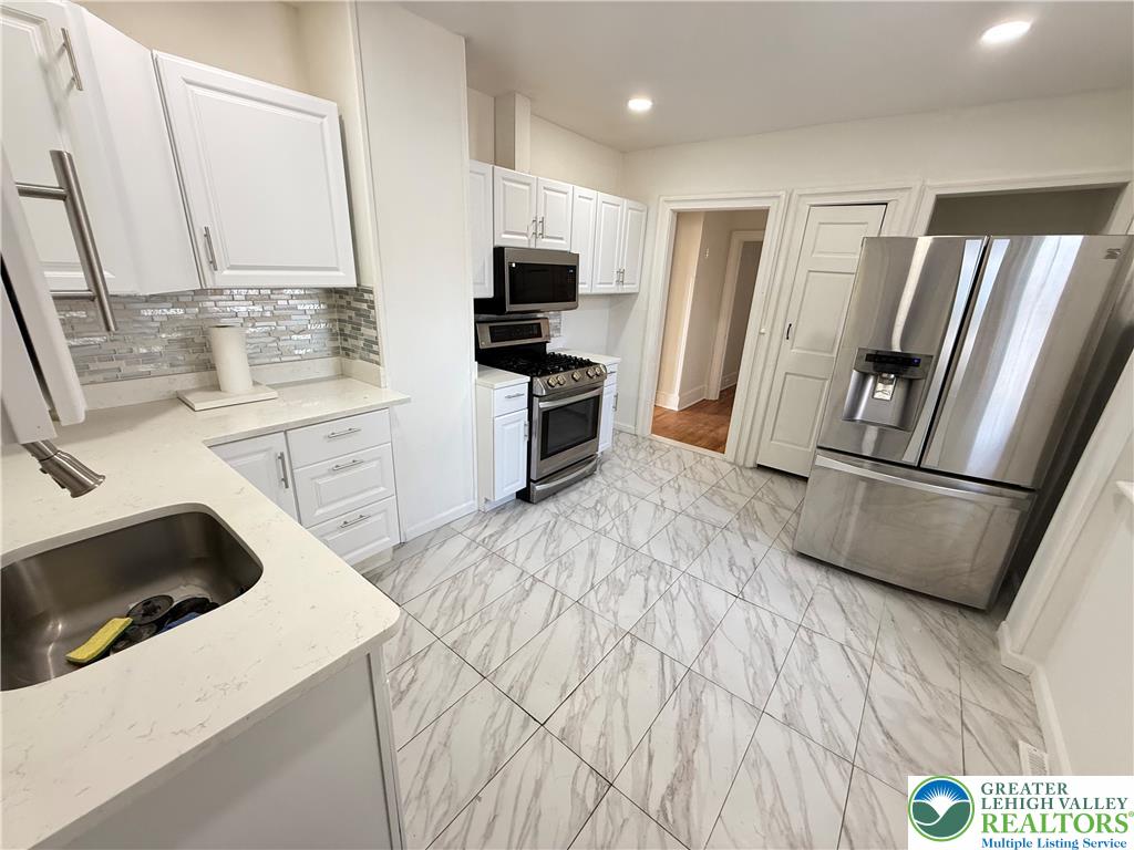 314 North Garfield Avenue Scranton, PA 18504 - Photo 10 of 21 A well-appointed kitchen features stainless steel appliances and crisp white cabinetry.
