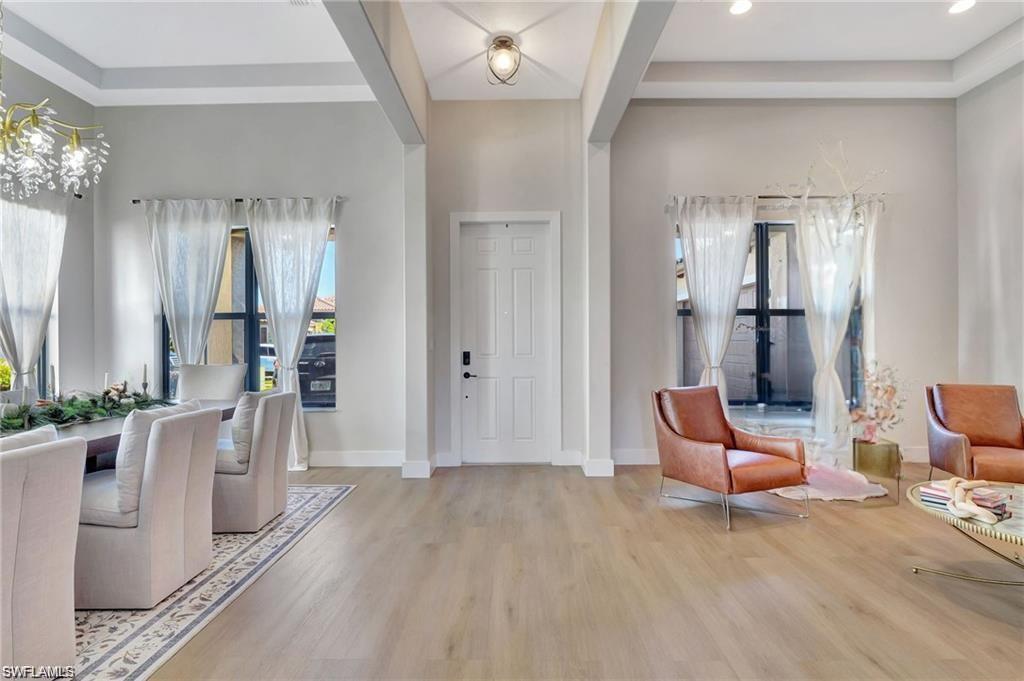 5123 Genoa Street Ave Maria, FL 34142 - Photo 2 of 34 a bedroom with furniture and natural light