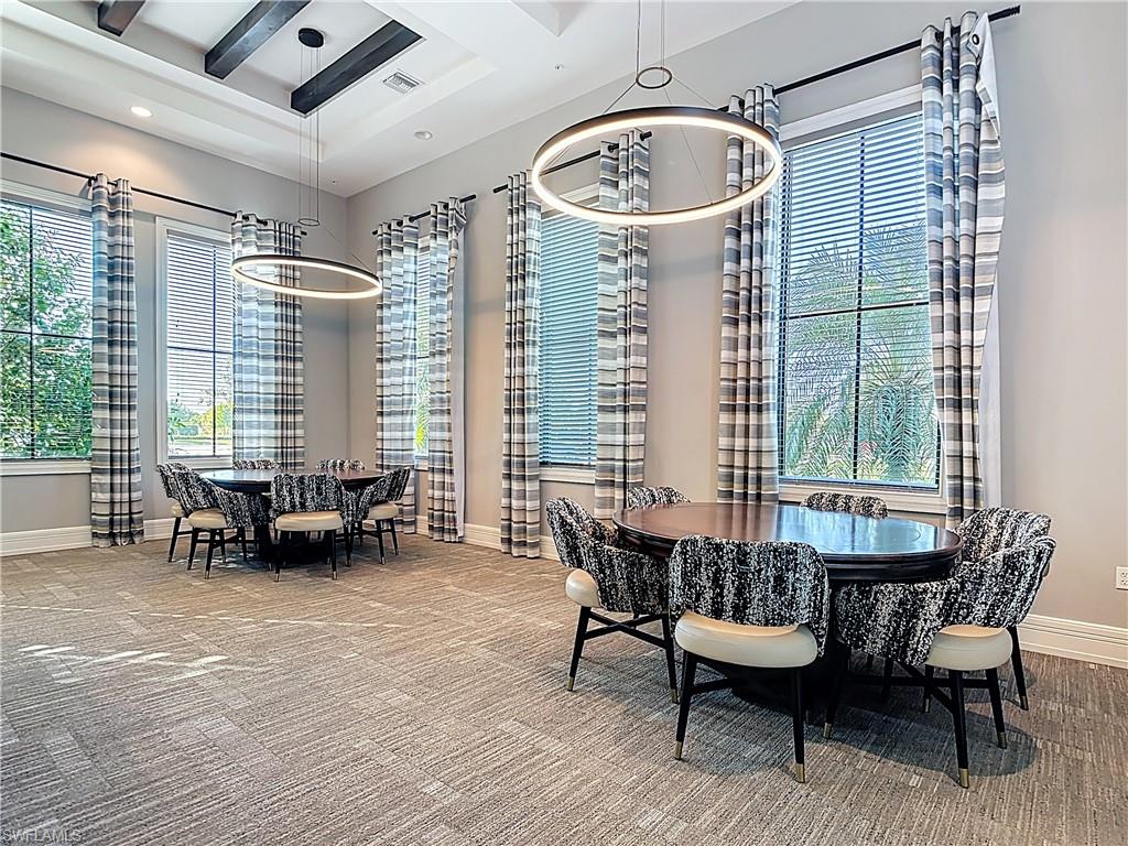 5123 Genoa Street Ave Maria, FL 34142 - Photo 27 of 34 a view of a dining room with furniture window and outside view