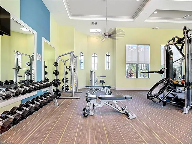 a view of a livingroom with furniture and a large window