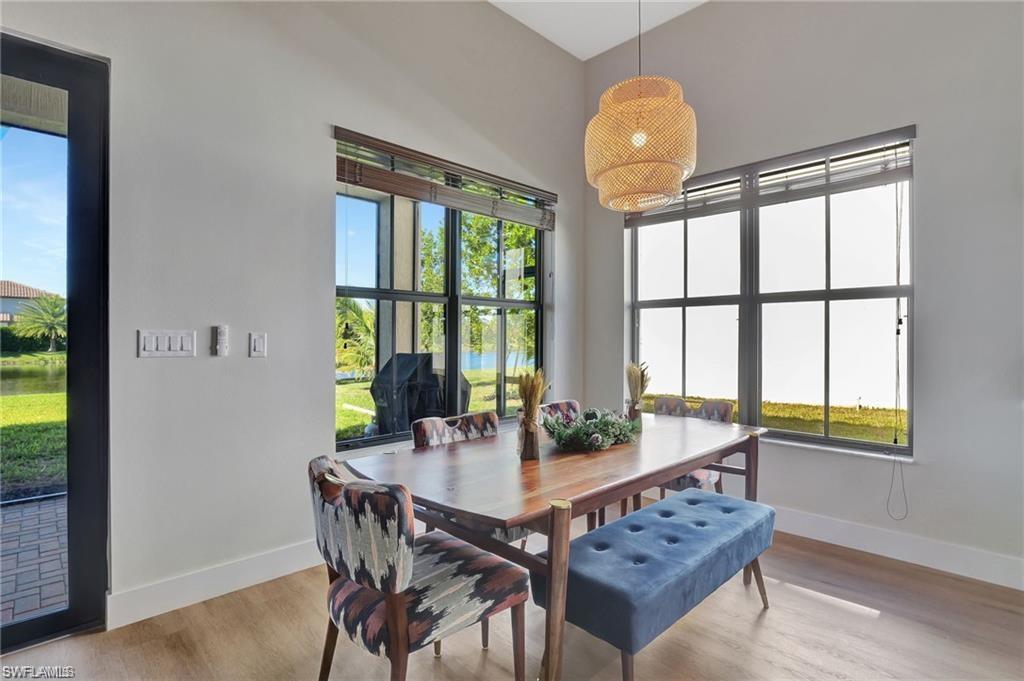 5123 Genoa Street Ave Maria, FL 34142 - Photo 7 of 34 a dining room with furniture and window