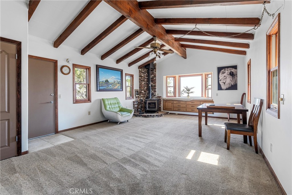 32451 Valyermo Road Pearblossom, CA 93553 - Photo 11 of 38 a living room with furniture and a window