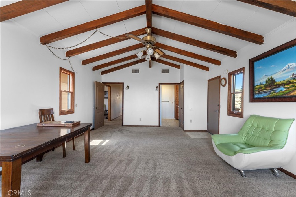 32451 Valyermo Road Pearblossom, CA 93553 - Photo 13 of 38 a view of a livingroom with furniture and windows